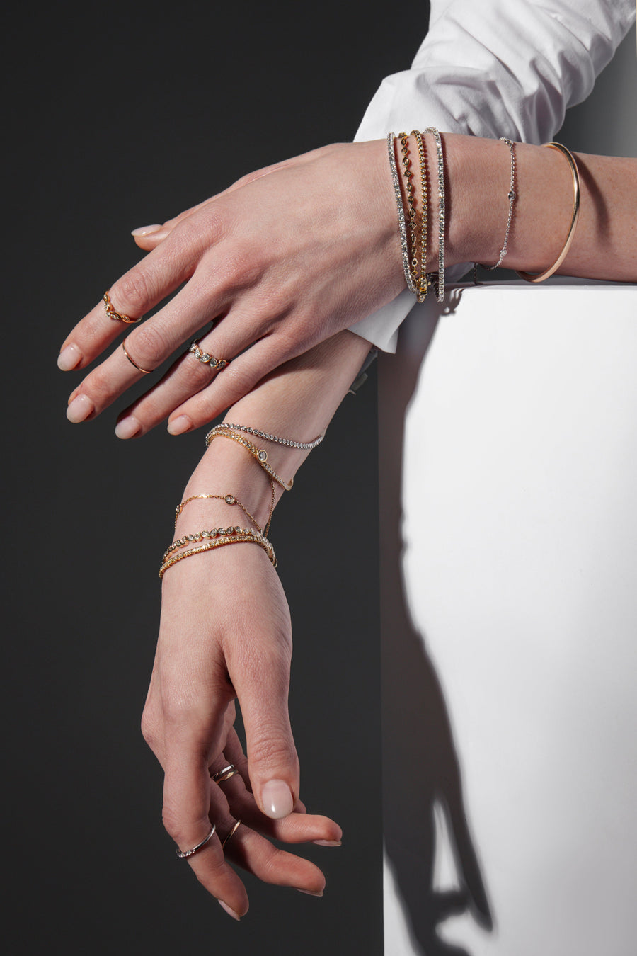 three gold and diamond bracelets